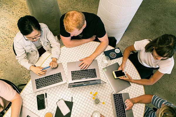 data freelancers working around the table top view